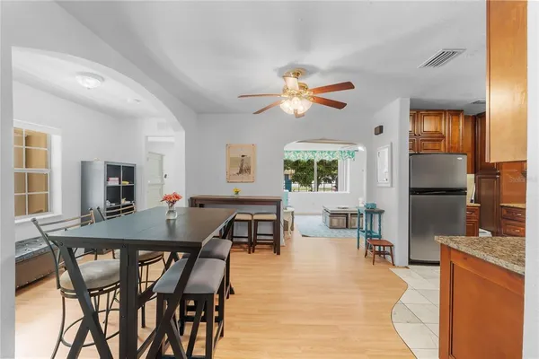 a dining room with furniture and window