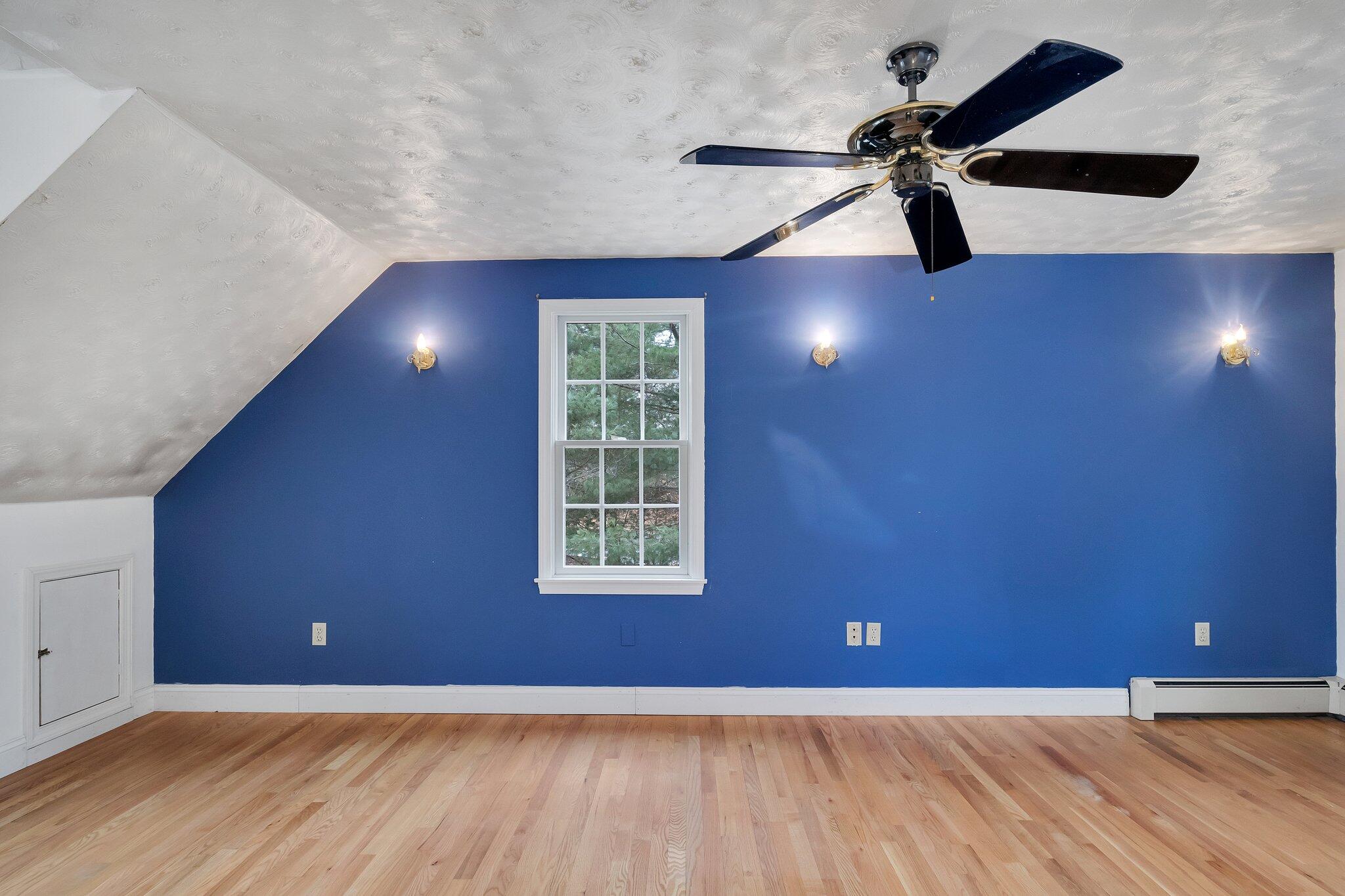 2 Windsor Way Mashpee, MA 02649 - Photo 23 of 53 an empty room with a window and a ceiling fan