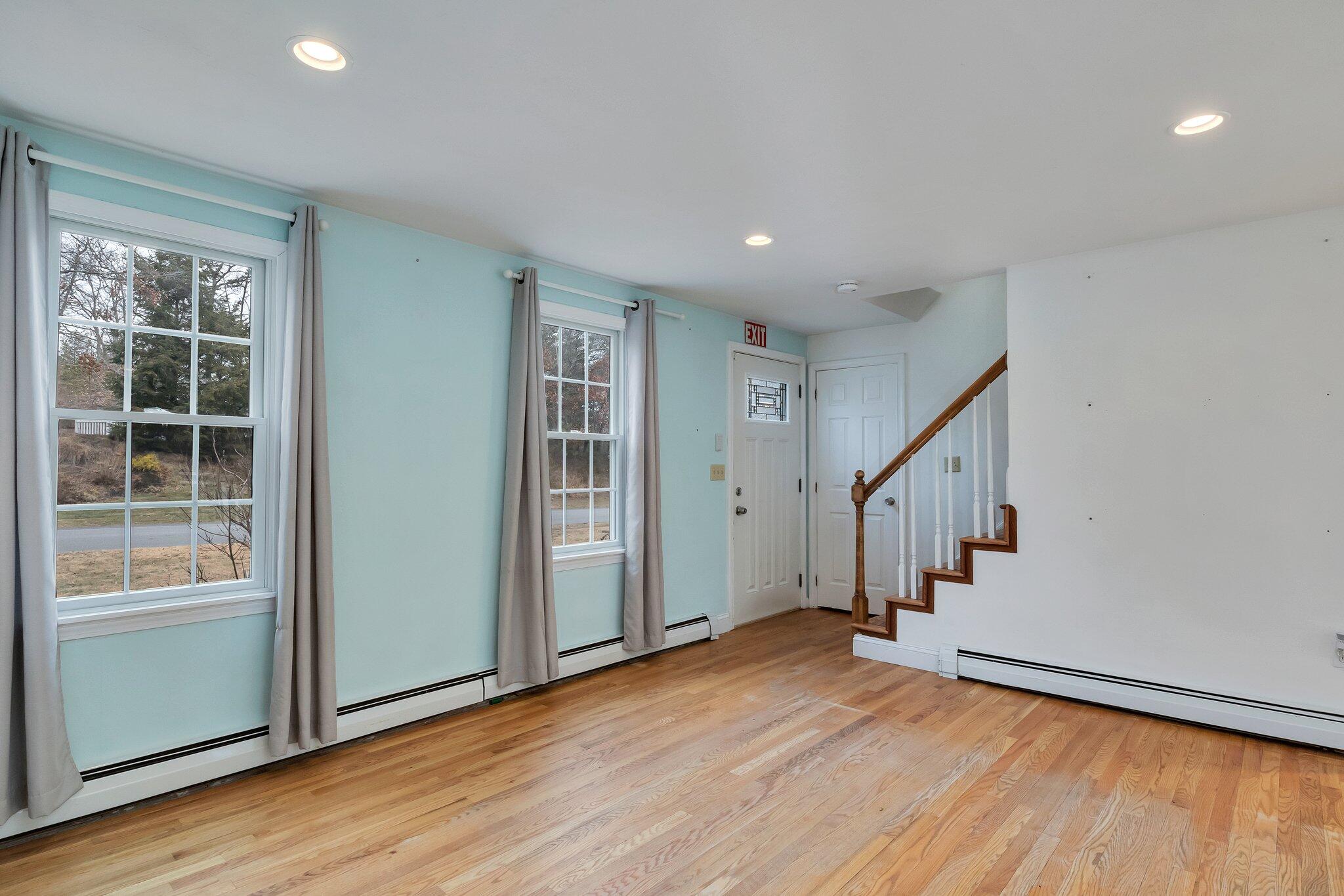 2 Windsor Way Mashpee, MA 02649 - Photo 10 of 53 wooden floor in an empty room with a window and wooden floor