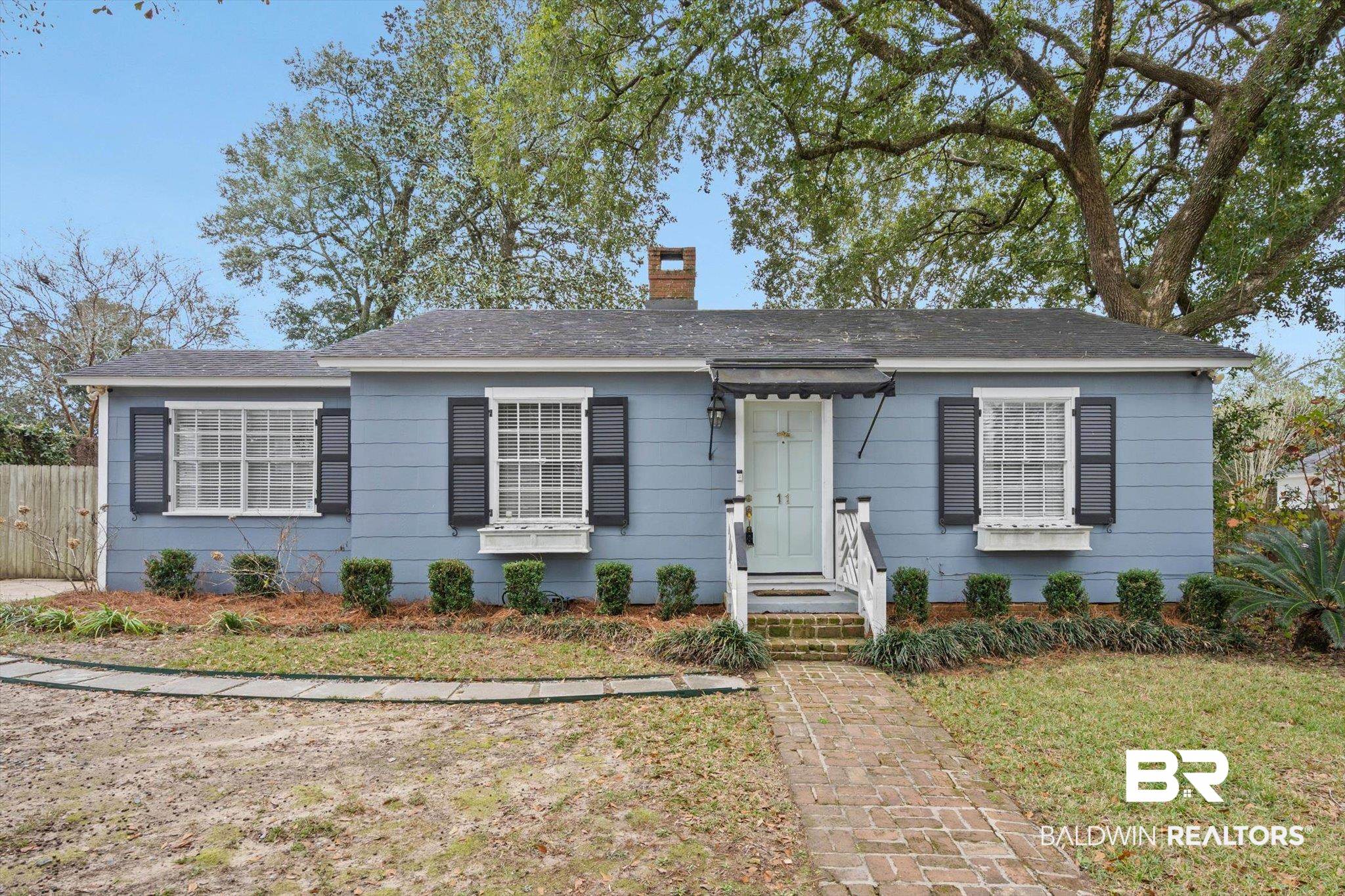 11 York Place Mobile, AL 36608 - Photo 1 of 24 Bungalow-style house featuring a chimney and roof with shingles