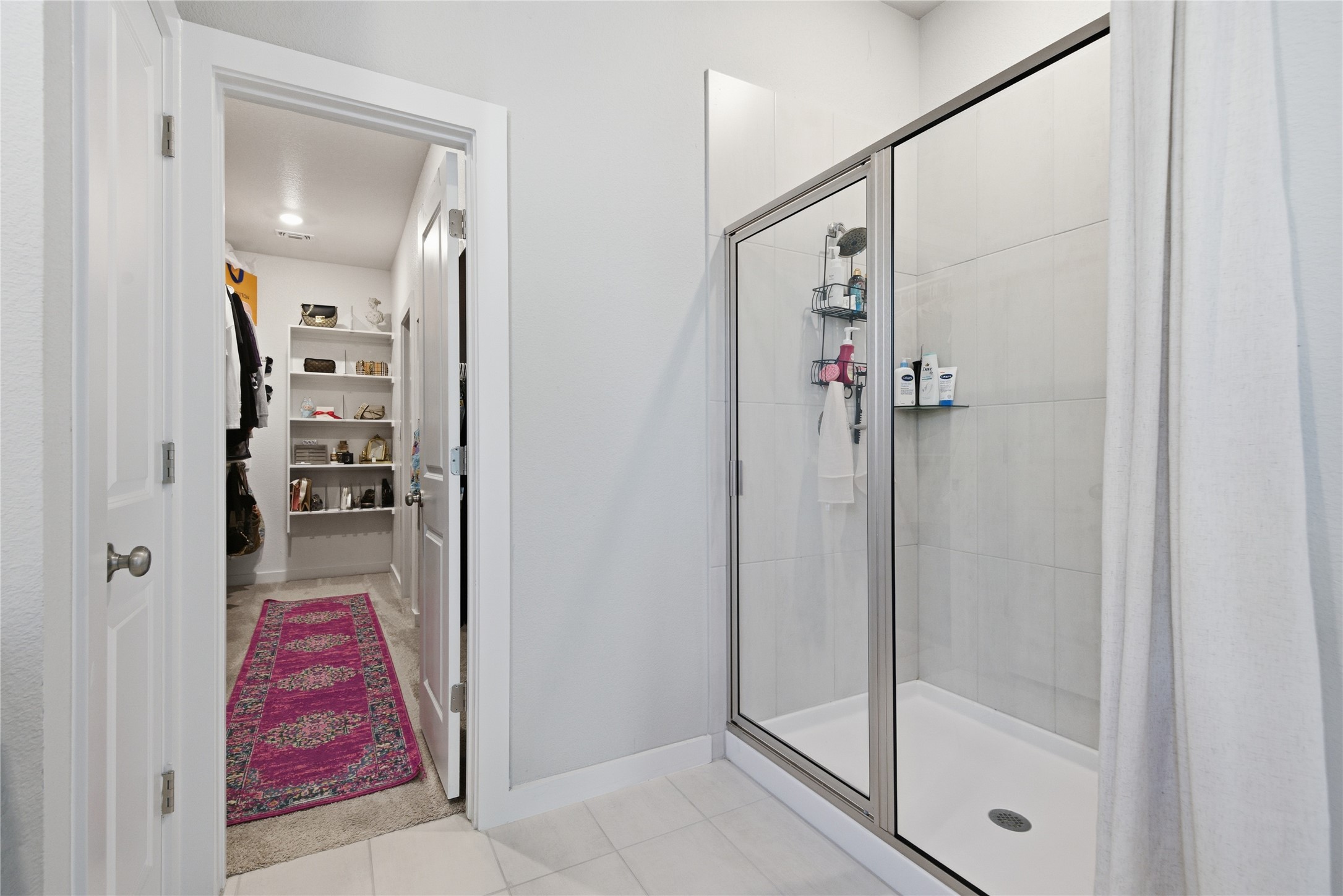 1008 Summer Glen Georgetown, TX 78628 - Photo 20 of 34 a bathroom with a glass shower door