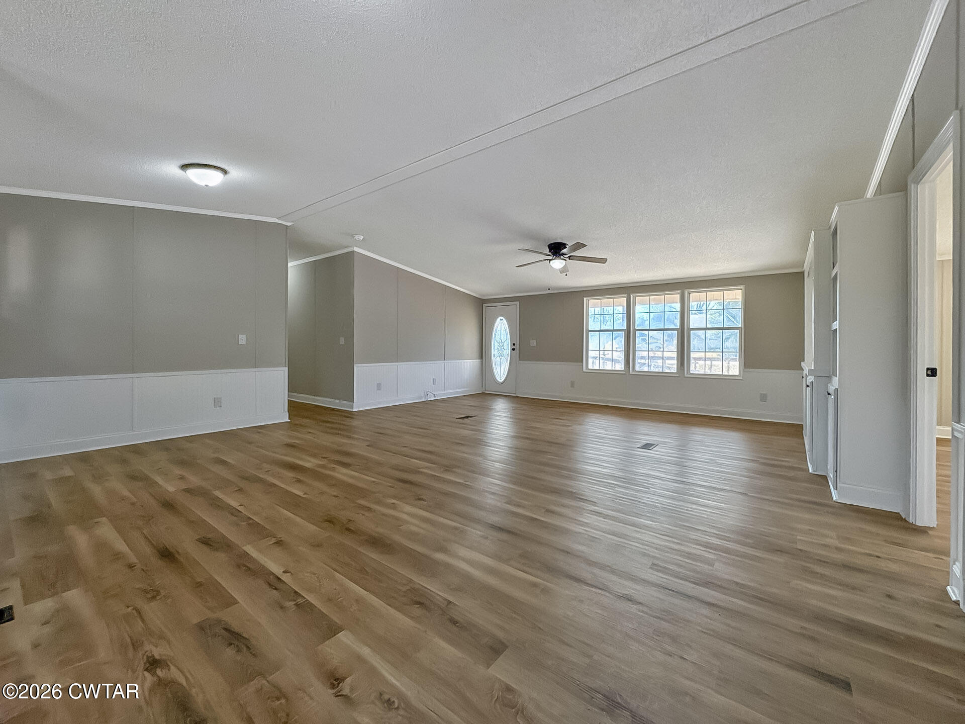 643 Eaton Brazil Road Trenton, TN 38382 - Photo 4 of 13 wooden floor in an empty room with a window