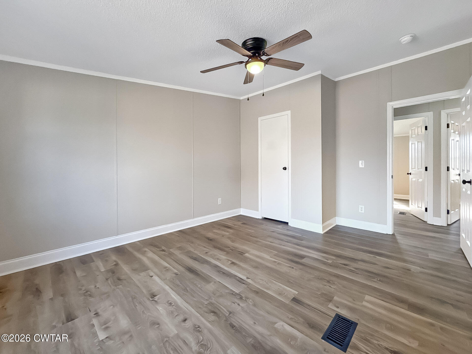 643 Eaton Brazil Road Trenton, TN 38382 - Photo 8 of 13 a view of empty room with wooden floor