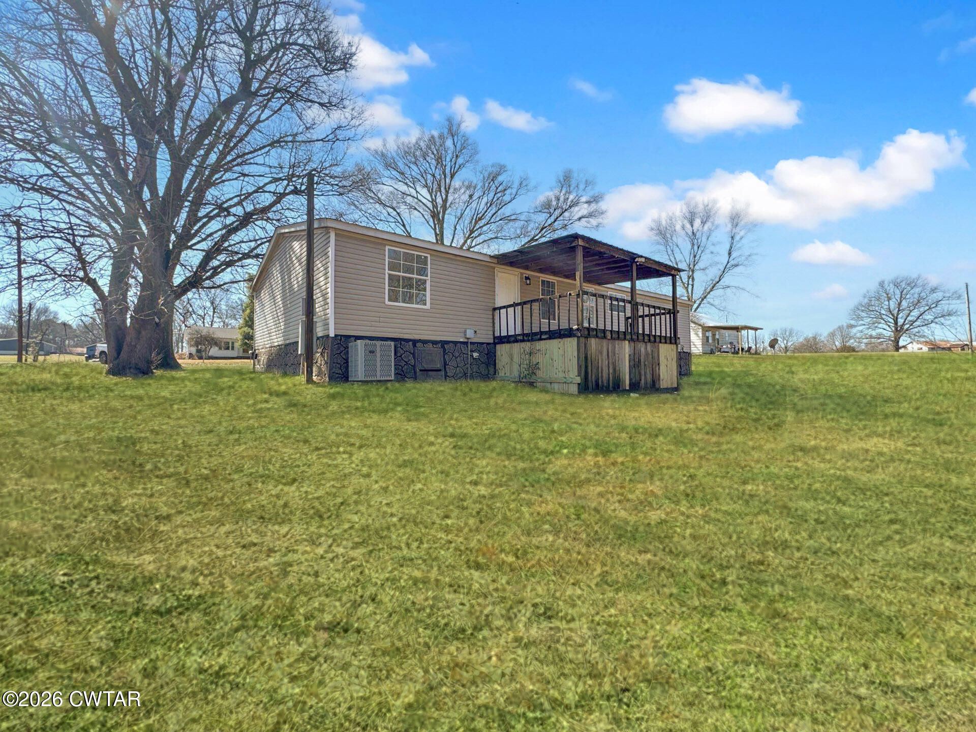 643 Eaton Brazil Road Trenton, TN 38382 - Photo 10 of 13 a view of a house with a big yard