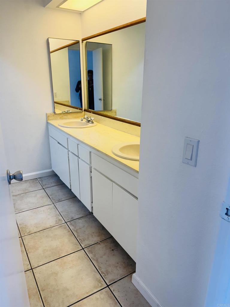 9170 Circulo Margen Spring Valley, CA 91977 - Photo 5 of 9 a bathroom with a bathtub and a sink