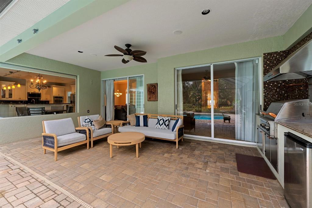 5614 Eagleglen Place Lithia, FL 33547 - Photo 25 of 35 a living room with furniture and a flat screen tv