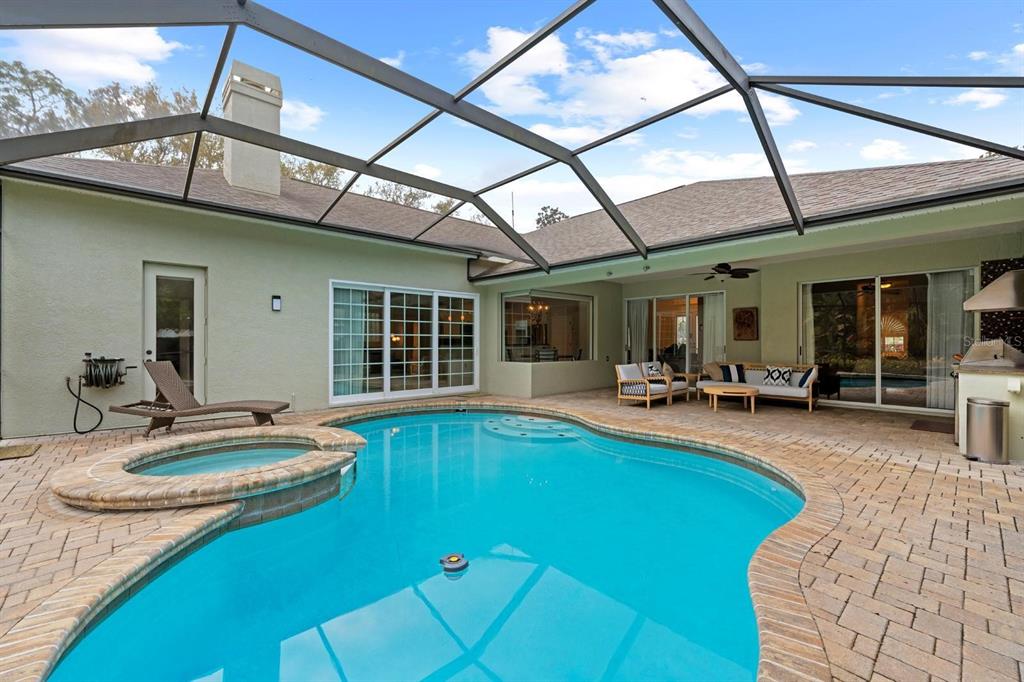 5614 Eagleglen Place Lithia, FL 33547 - Photo 27 of 35 a swimming pool with outdoor seating and yard