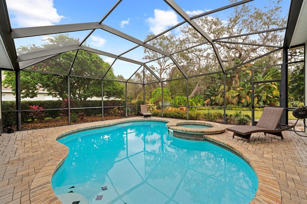 5614 Eagleglen Place Lithia, FL 33547 - Photo 28 of 35 a view of a swimming pool with a patio