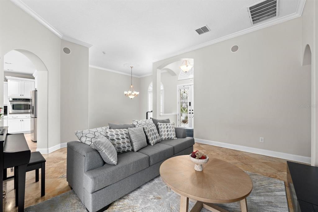 5614 Eagleglen Place Lithia, FL 33547 - Photo 9 of 35 a living room with furniture and a potted plant