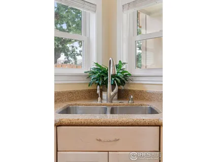 a view of bathroom with granite countertop a potted plant