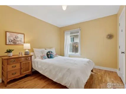 a bedroom with a bed and a desk