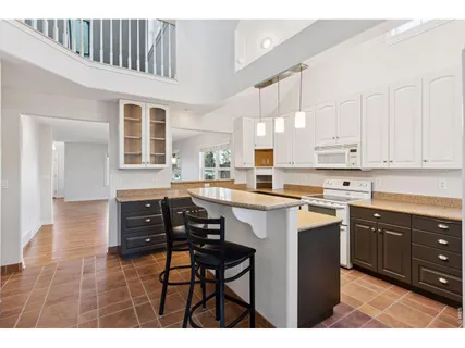 a bathroom with a double vanity sink and mirror with shower