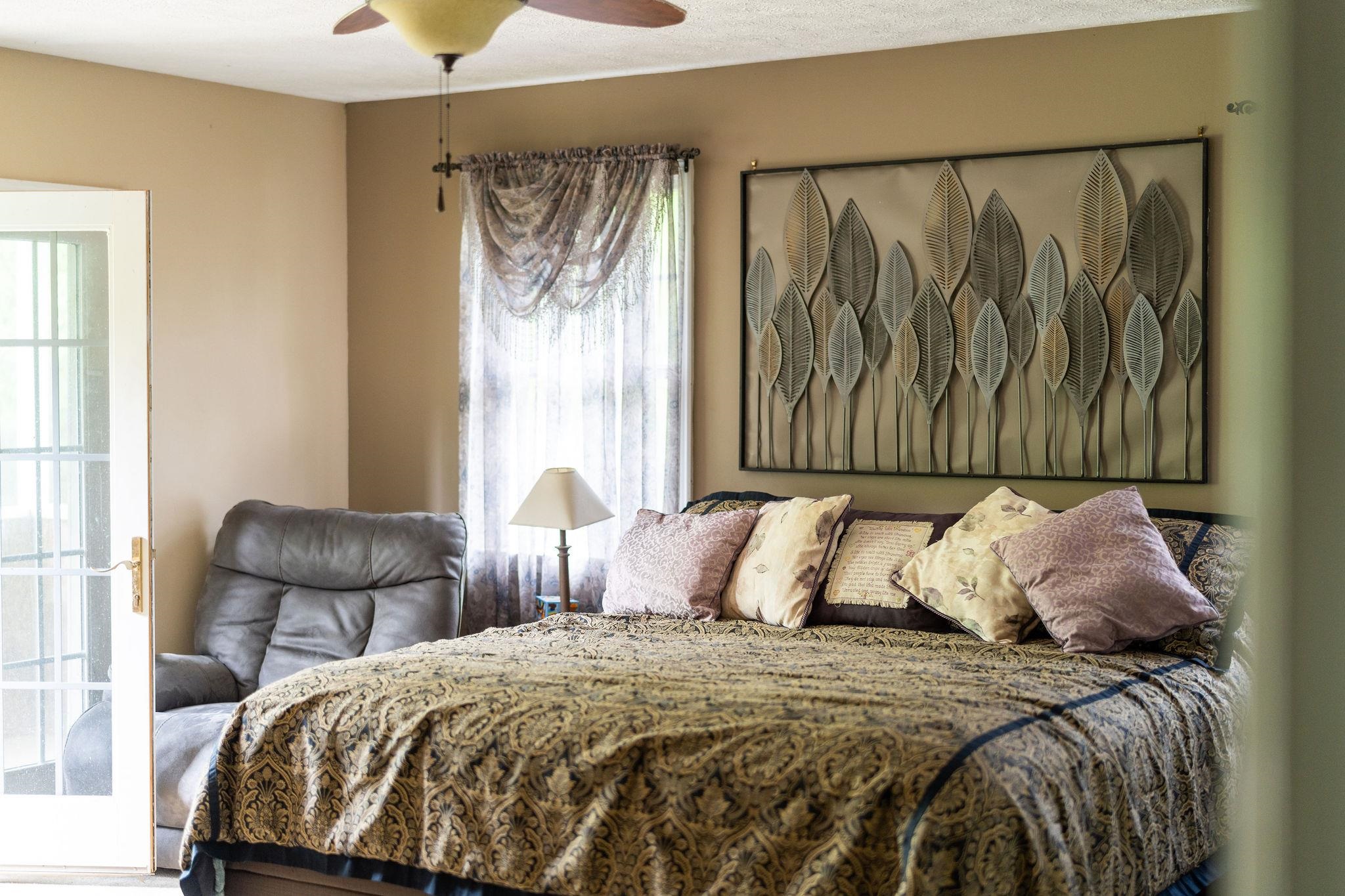 516 Estaline Valley Road Craigsville, VA 24430 - Photo 30 of 75 a bedroom with a bed and chair