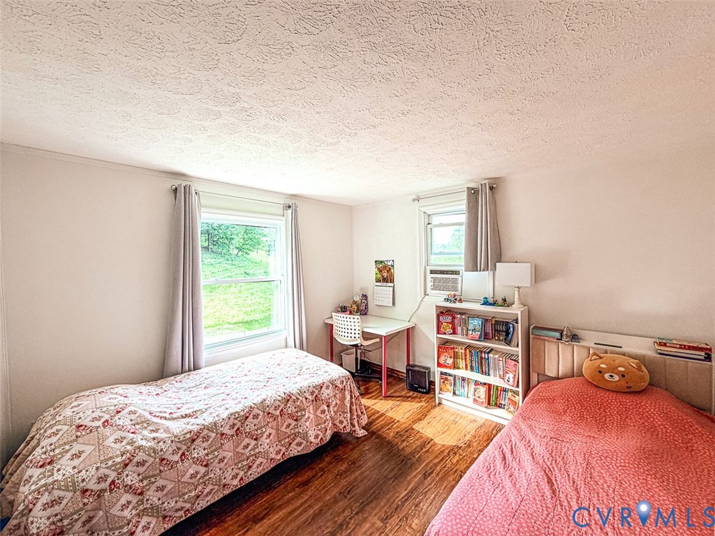 453 Long Hollow Road Cleveland, VA 24225 - Photo 22 of 50 a bedroom with a bed and a window