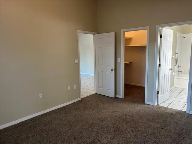 an empty room with closet area