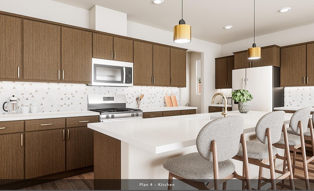 527 Willow Bend Lathrop, CA 95330 - Photo 3 of 22 a kitchen with a table chairs sink and cabinets