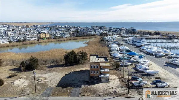 an aerial view of a house with a lake view