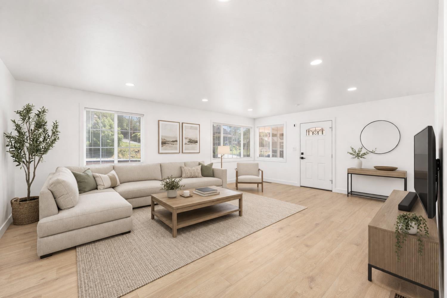 185 Mill Street Sutter Creek, CA 95685 - Photo 19 of 77 a living room with furniture wooden floor and a large window