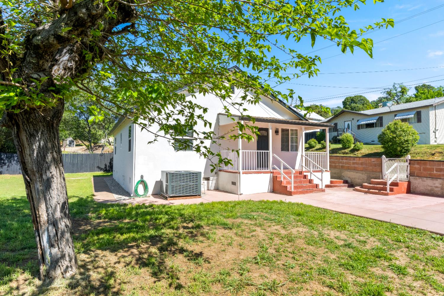 185 Mill Street Sutter Creek, CA 95685 - Photo 60 of 77 a front view of a house with garden and sitting area