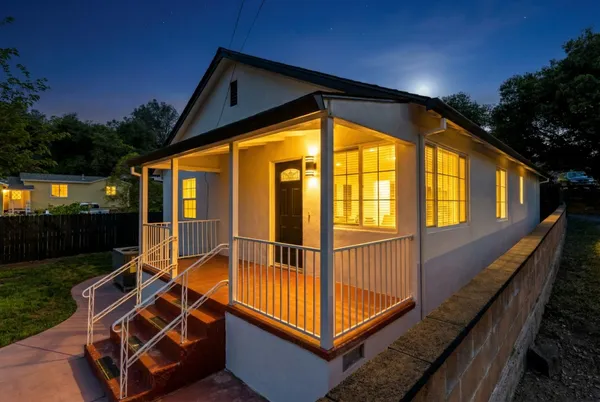 a front view of a house with a porch