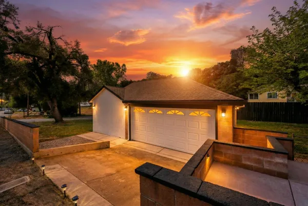 a living room with furniture wooden floor and a large window