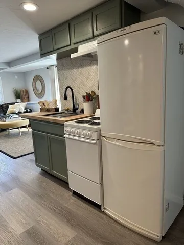 a view of a storage and utility room with washer and dryer