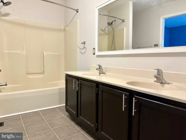 a bathroom with a sink and a bathtub