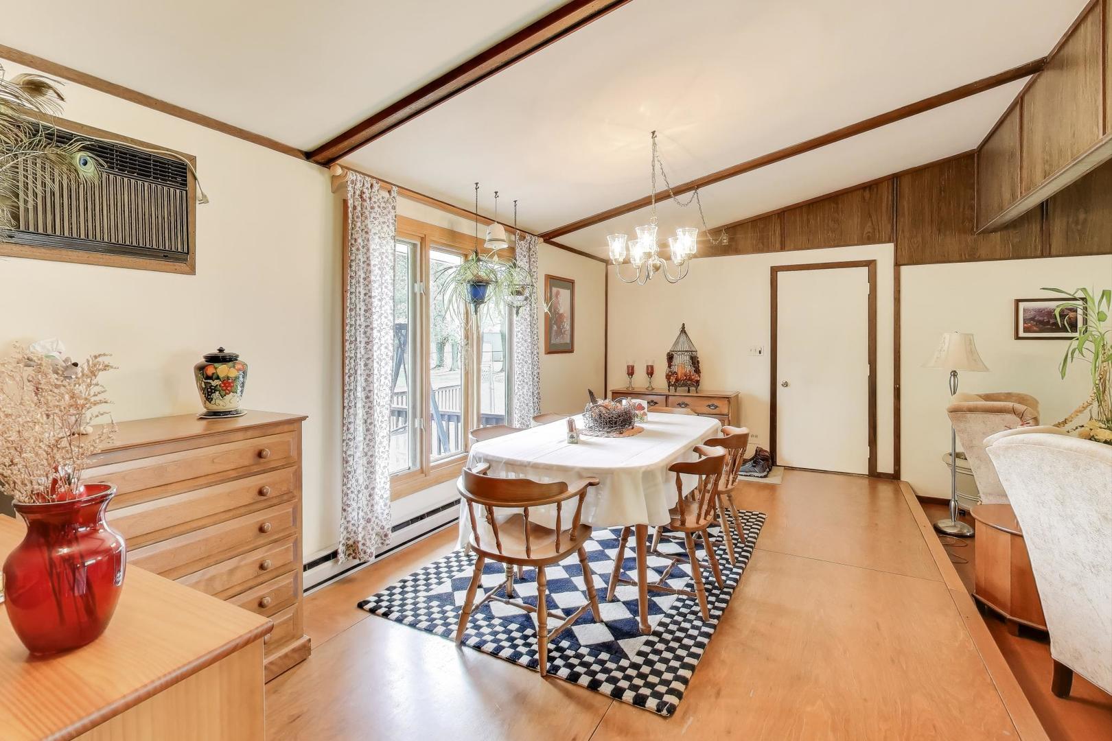 27809 South Will Center Road Monee, IL 60449 - Photo 11 of 47 a view of a dining room with furniture and chandelier
