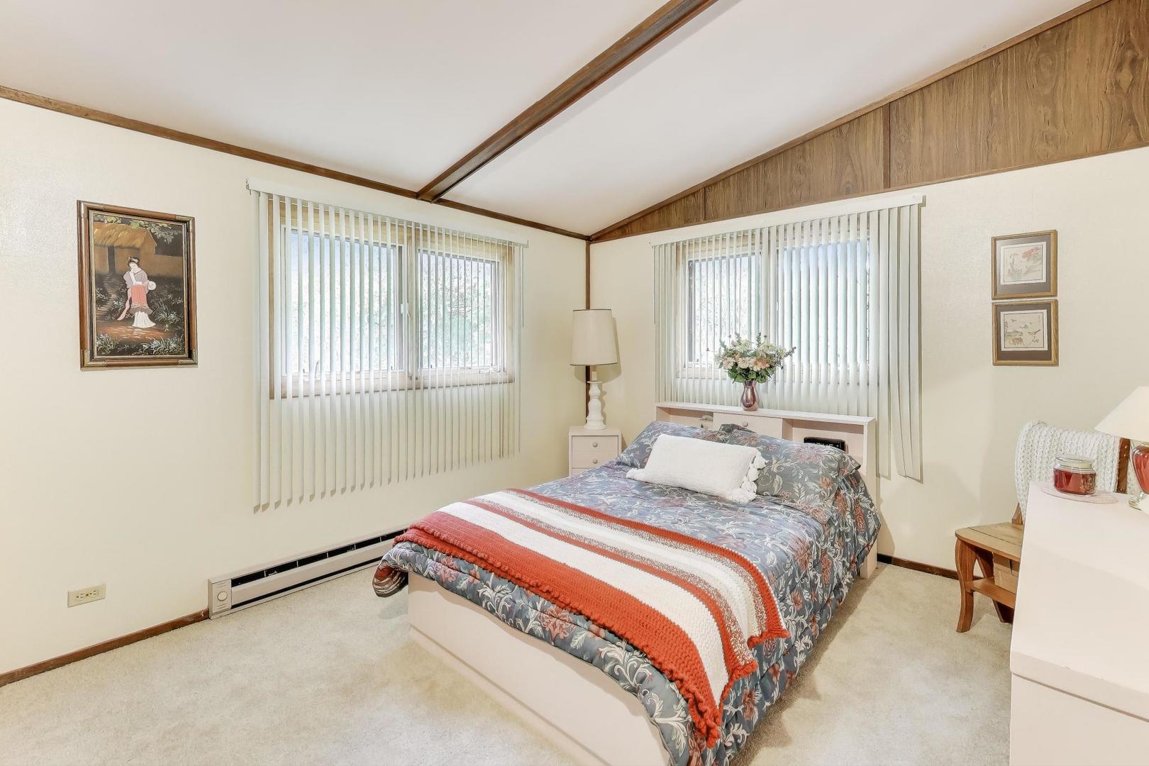 27809 South Will Center Road Monee, IL 60449 - Photo 19 of 47 a bedroom with a bed and a window