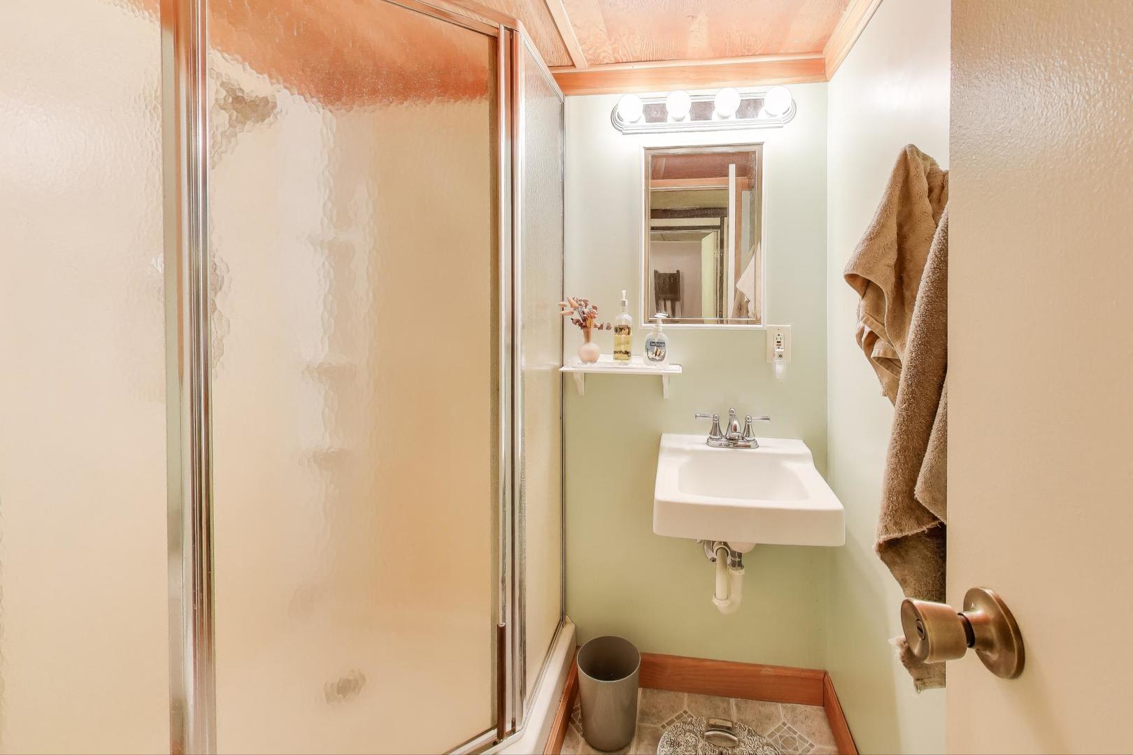 27809 South Will Center Road Monee, IL 60449 - Photo 31 of 47 a bathroom with a sink and mirror with window