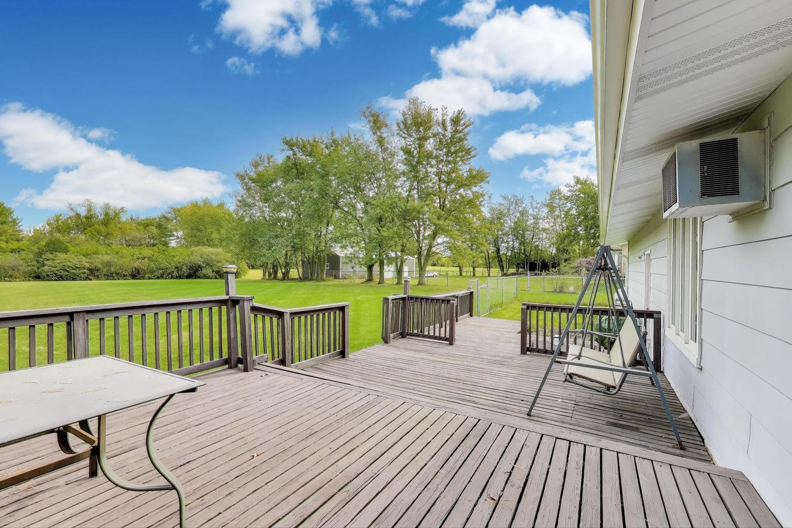 27809 South Will Center Road Monee, IL 60449 - Photo 33 of 47 a view of a deck with wooden floor and outdoor seating