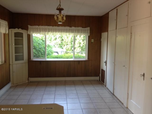 2490 Ashue Road Wapato, WA 98951 - Photo 8 of 11 a view of room with window and hardwood