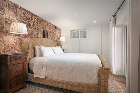 a bedroom with a bed and a cabinets