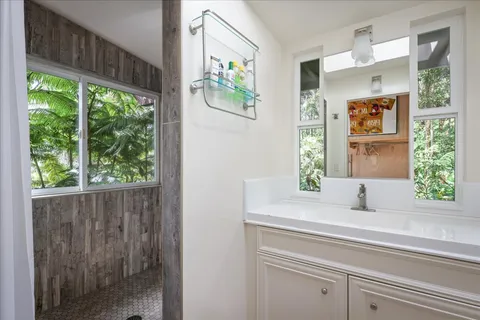 a bathroom with a sink and a large mirror