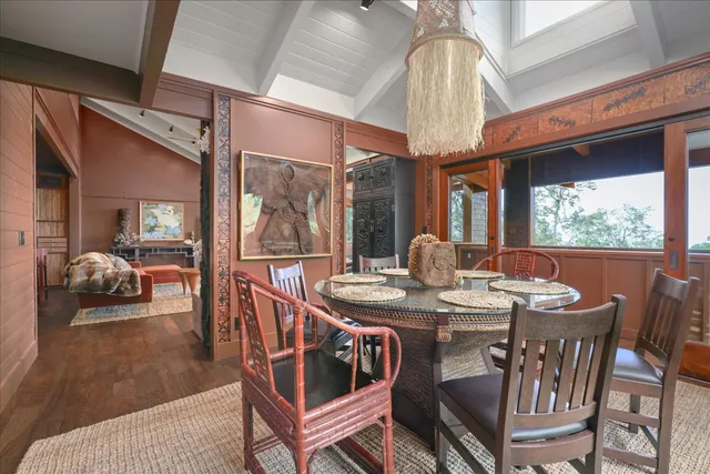 a view of a dining room with furniture wooden floor and chandelier