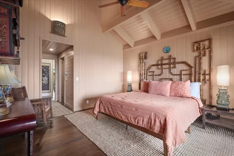 a bedroom with a bed and lamp