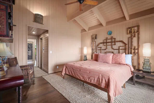 a bedroom with a bed and lamp