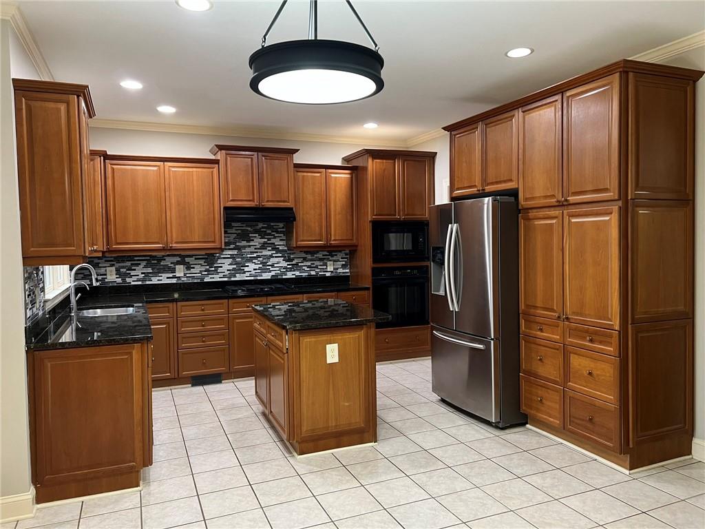 2476 Sewell Mill Road Marietta, GA 30062 - Photo 14 of 43 a kitchen with stainless steel appliances granite countertop a refrigerator a stove and a sink