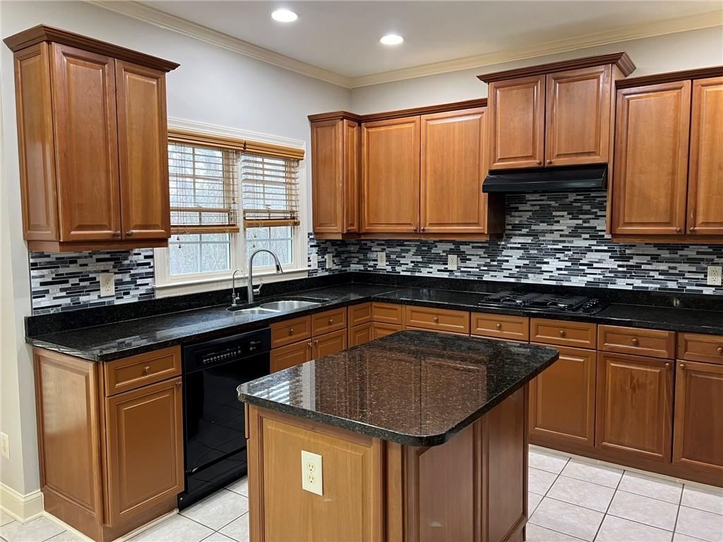 2476 Sewell Mill Road Marietta, GA 30062 - Photo 17 of 43 a kitchen that has a sink and a stove in it