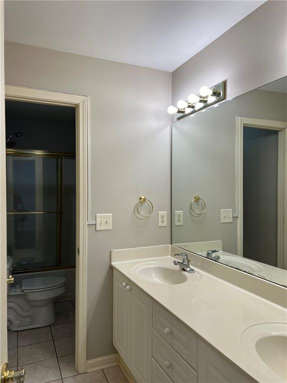 2476 Sewell Mill Road Marietta, GA 30062 - Photo 29 of 43 a bathroom with a double vanity sink and a mirror