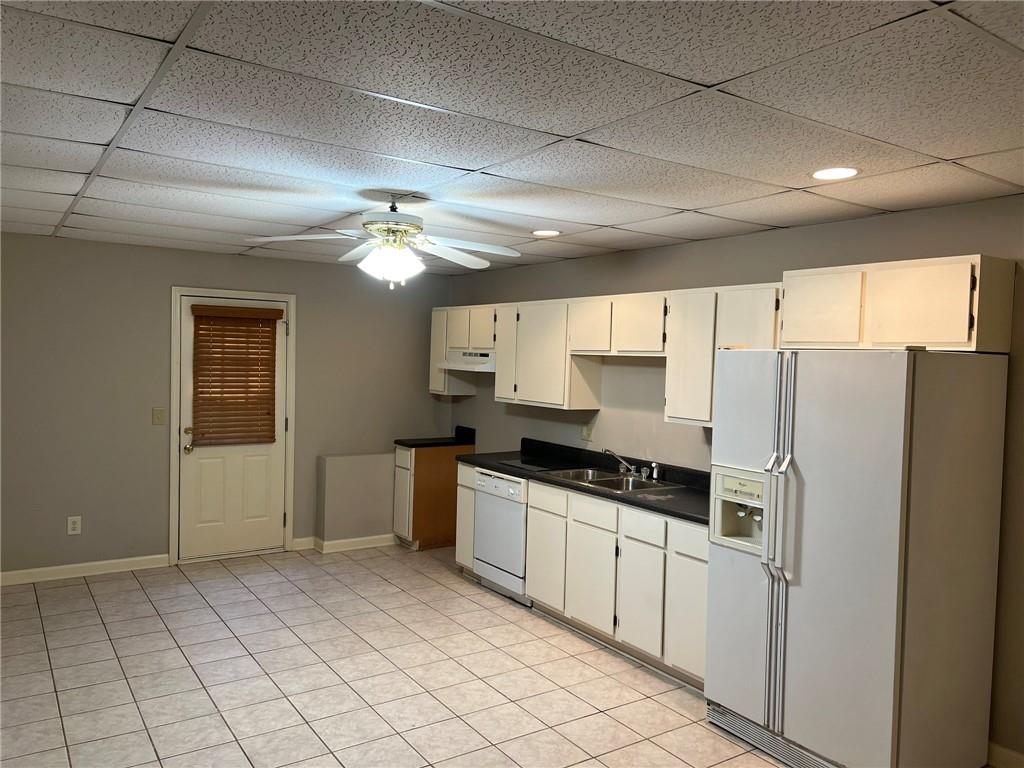 2476 Sewell Mill Road Marietta, GA 30062 - Photo 33 of 43 a kitchen with granite countertop a refrigerator and a sink