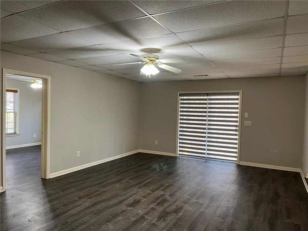 2476 Sewell Mill Road Marietta, GA 30062 - Photo 34 of 43 a view of empty room with wooden floor and fan