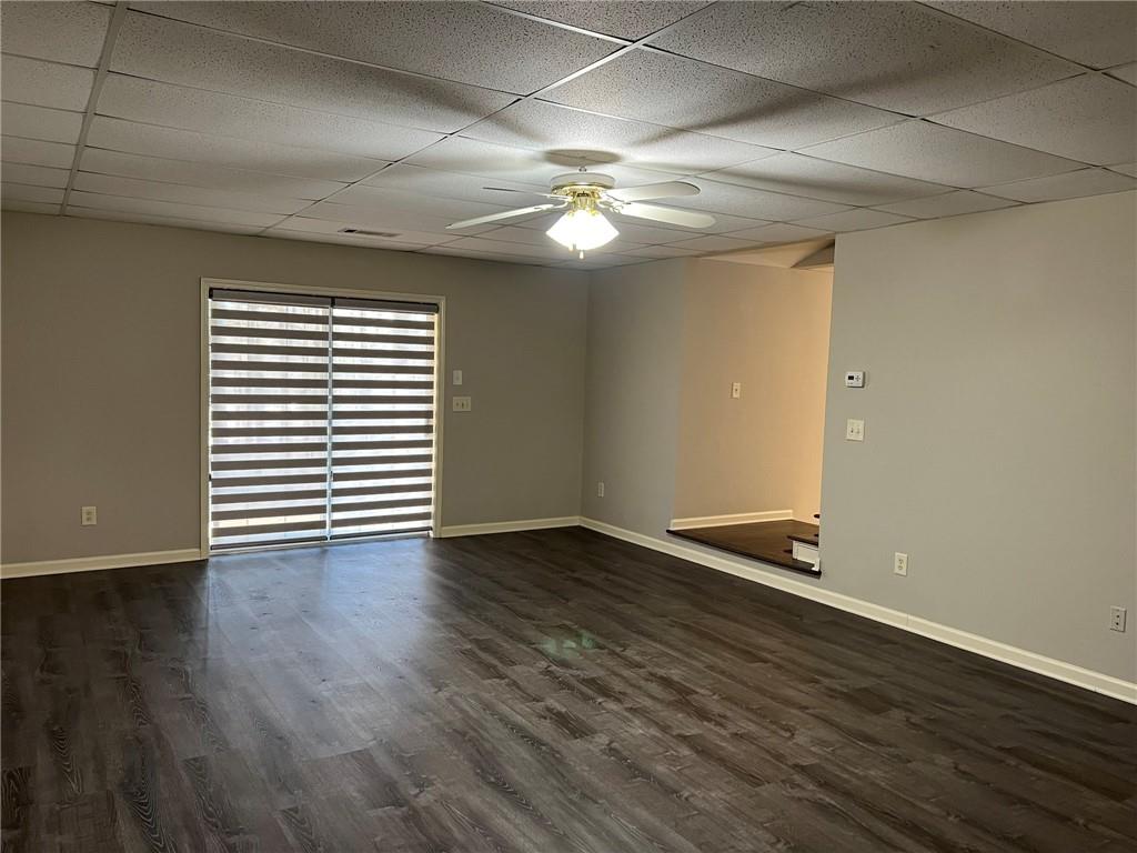 2476 Sewell Mill Road Marietta, GA 30062 - Photo 35 of 43 a view of an empty room with wooden floor and a window