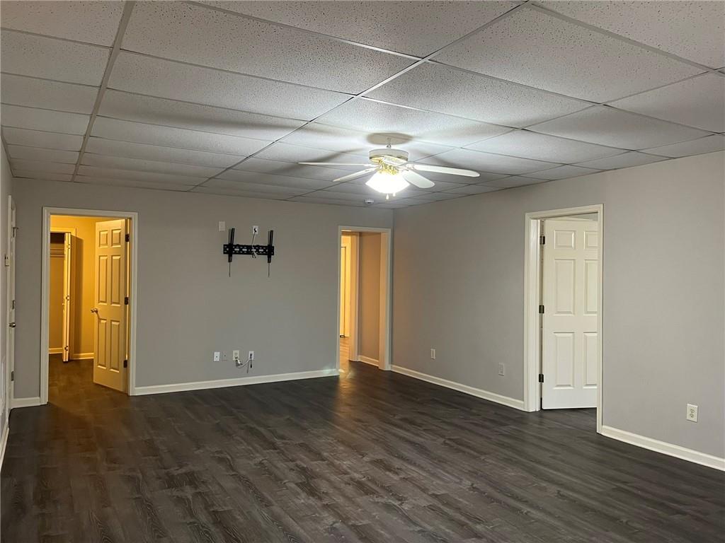 2476 Sewell Mill Road Marietta, GA 30062 - Photo 36 of 43 an empty room with wooden floor and windows