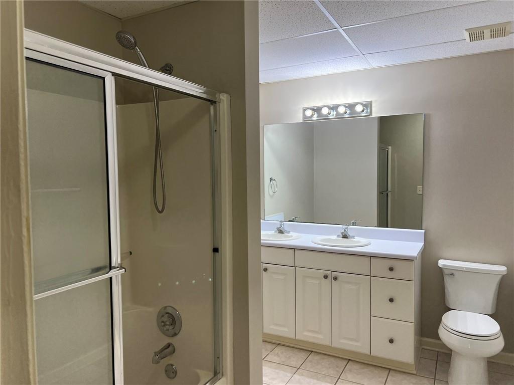 2476 Sewell Mill Road Marietta, GA 30062 - Photo 38 of 43 a bathroom with a double vanity sink toilet and shower