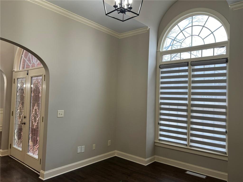 2476 Sewell Mill Road Marietta, GA 30062 - Photo 5 of 43 wooden floor in an empty room and a window