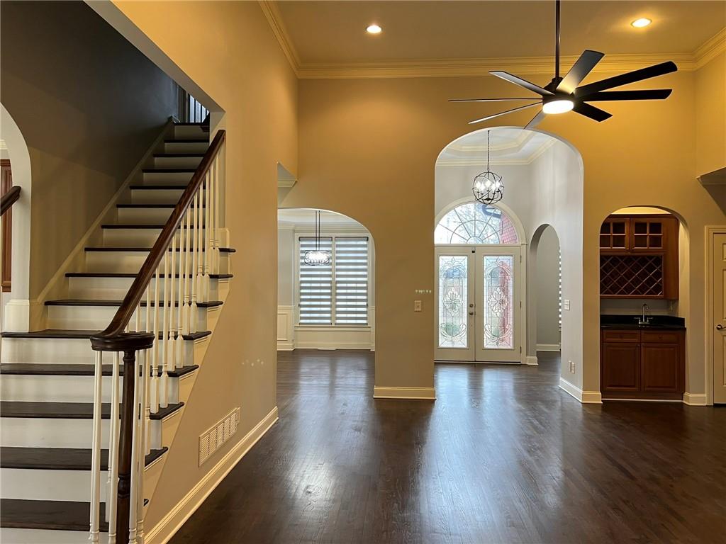 2476 Sewell Mill Road Marietta, GA 30062 - Photo 7 of 43 a view of a livingroom with wooden floor staircase