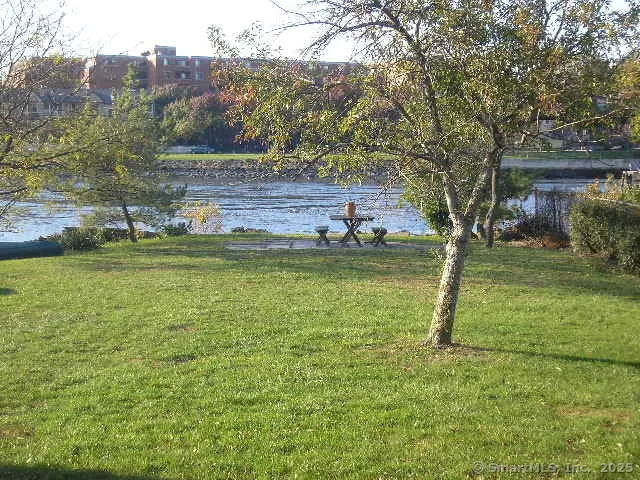 a view of a lake with a house in the background
