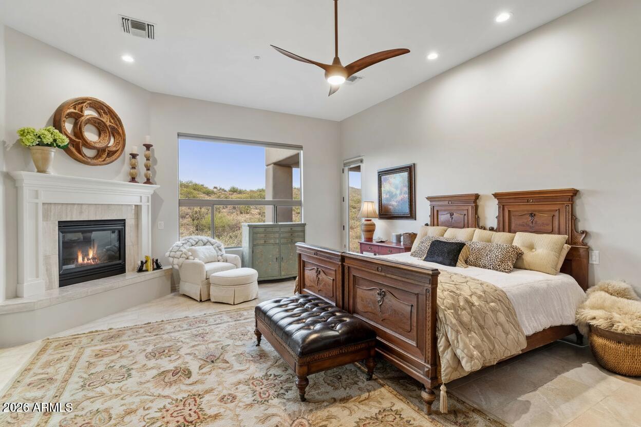 15730 East Eagle Crest Road Fountain Hills, AZ 85268 - Photo 4 of 77 a bedroom with a bed and a fireplace