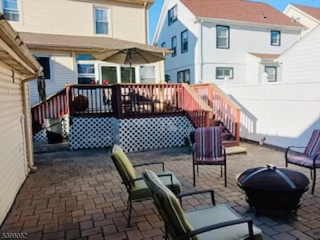 a view of a patio with a table and chairs